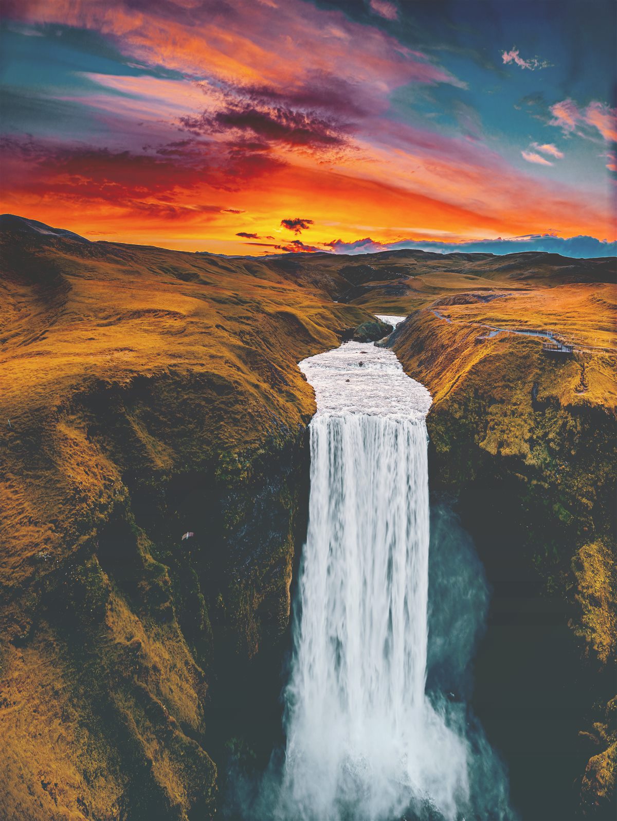 Sk&oacute;gafoss waterfall at sunset, Iceland